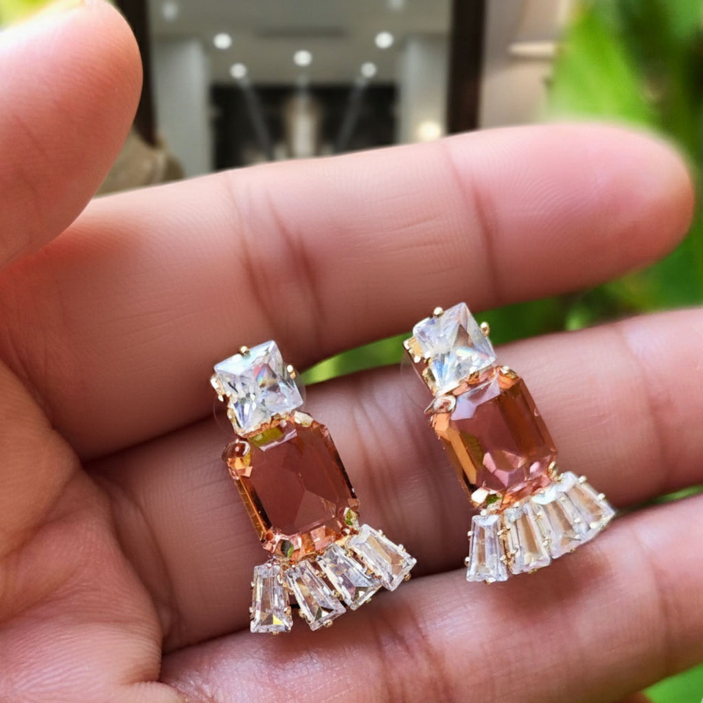 Amber and clear crystal Western-style earrings on tabletop background – premium fashion jewelry for women